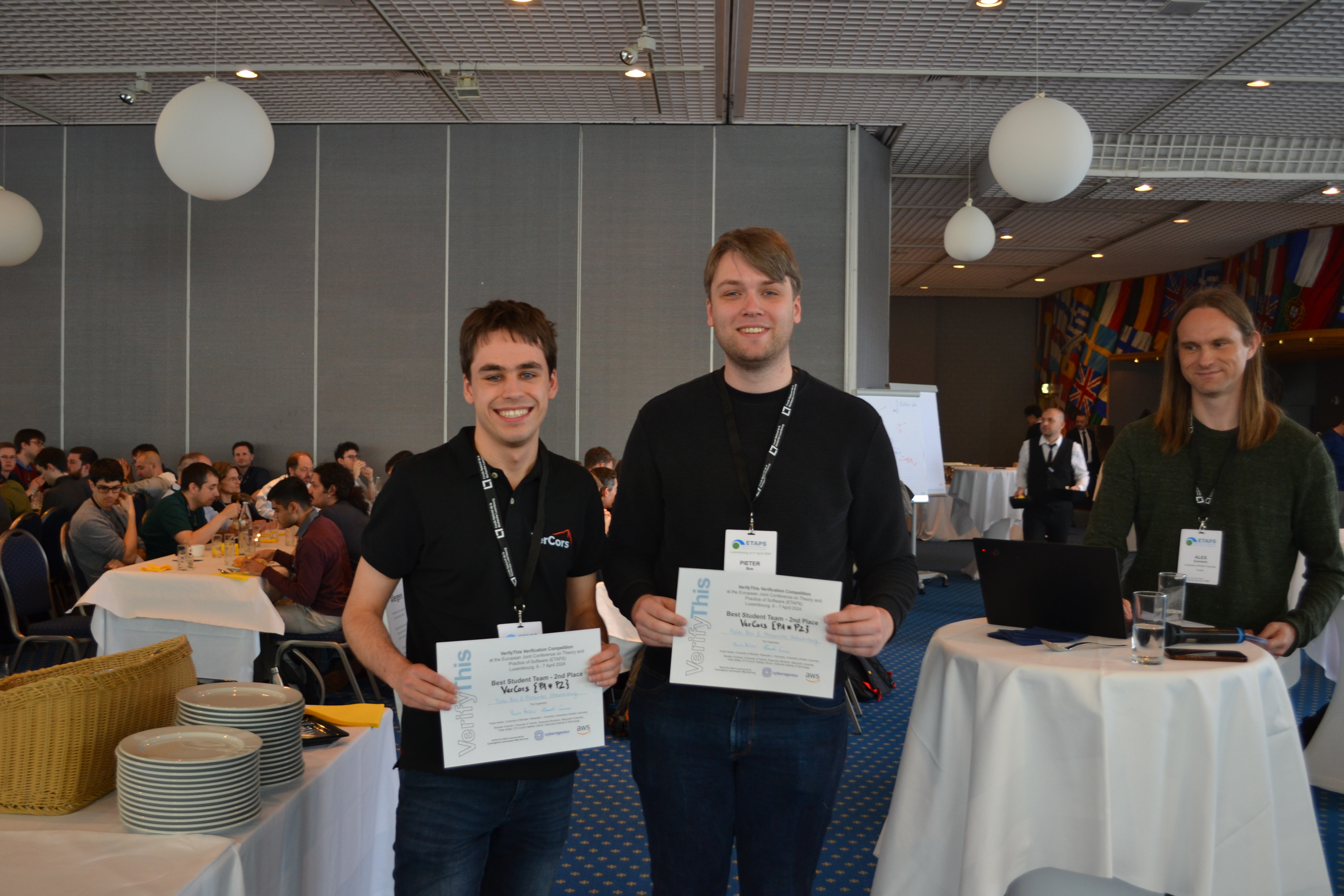 Alexander Stekelenburg and Pieter Bos holding certificates reading Best Student Team - 2nd place - VerCors {P1*P2}